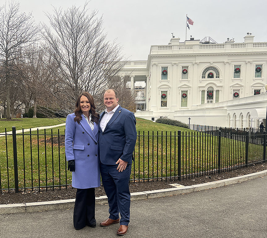 Image shows US Ag Secretary Brooke Rollins and ICGA Vice President Tyler Everett smiling in front of the White House.